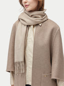 Unisex Organic Fringed Cashmere Woven Scarf Warm Grey worn by model, detail view on white background
