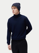 Unisex Cashmere Rib Knit Beanie Navy Blazer worn by model, side view on white background
