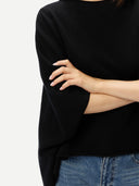 Women's Black Cashmere  Knitted Poncho worn by model, detail view, on white background