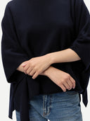 Women's Navy Cashmere  Knitted Poncho worn by model, detail view, on white background
