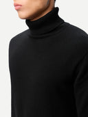 Men's Black Turtleneck Cashmere Sweater worn by model, detail view on white background