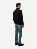 Men's Black Turtleneck Cashmere Sweater worn by model, back view on white background