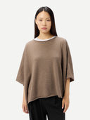Women's Taupe Knitted Poncho worn by model, front view, on white background