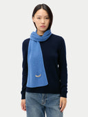 Cashmere Rib Knit Scarf Blue worn by model, detail view on white background
