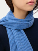 Cashmere Rib Knit Scarf Blue worn by model, detail view on white background