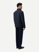 Men's CashmereTECH Jacket Navy Blazer worn by model, back view on white background #color_navy