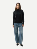 Women's Fold-Over Turtleneck Cashmere Sweater Black worn by model, front view on white background
