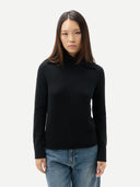 Women's Fold-Over Turtleneck Cashmere Sweater Black worn by model, detail view on white background