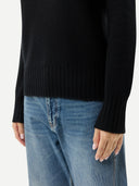 Women's Fold-Over Turtleneck Cashmere Sweater Black worn by model, detail view on white background