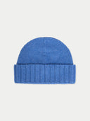 flat lay of a blue beanie on a light gray background