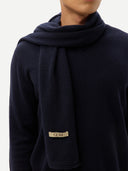 Cashmere Jersey Knit scarf Navy worn by model, detail view on white background
