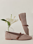 Pair of beige shoes with brown straps on a light gray background #color_nougat-brown