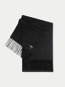 Black scarf with fringes on a light gray background