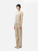 Women's Warm Grey Cashmere V-neck Button Cardigan worn by model, detail view on white background