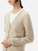 Women's Warm Grey Cashmere V-neck Button Cardigan worn by model, side view on white background