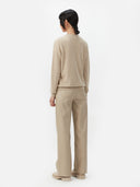 Women's Warm Grey Cashmere Crew Neck Cardigan worn by model, back view on white background