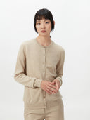 Women's Warm Grey Cashmere Crew Neck Cardigan worn by model, detail view on white background