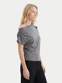 Women's Grey Cashmere Asymmetrical Top worn by model, side view on white background