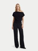 Women's Black Cashmere Asymmetrical Top worn by model, front view on white background