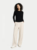 Women's Black Cashmere Crewneck Sweater worn by model, front view on white background