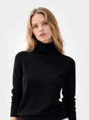 Women's Classic Cashmere Turtleneck Sweater Black worn by model, detail view, on white background