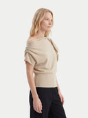 Women's Beige Cashmere Asymmetrical Top worn by model, side view on white background