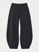 Dark charcoal gray wide-leg cropped pants with an elastic waistband, shown flat against a light gray background.