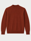 A rust-colored knit sweater with a mock neck, long sleeves, and ribbed cuffs and hem, shown flat against a light gray background.