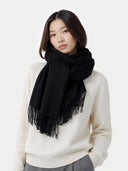 Wide Fringe Scarf Black worn by model, detail view on white background #color_black