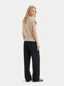 Women's Beige Cashmere Asymmetrical Top worn by model, back view on white background