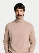 Men's Beige Turtleneck Cashmere Sweater worn by model, detail view on white background