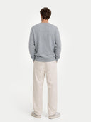 Men's Grey Crewneck Cashmere Sweater worn by model, back view on white background