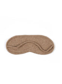 A single sleep mask in a soft, textured taupe-brown fabric, laid flat against a solid white background.