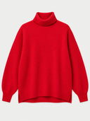 A bright red knit turtleneck sweater with balloon sleeves, displayed flat against a light gray background.
