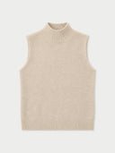 A sleeveless knit mock neck vest in a light beige color, shown flat against a light gray background.