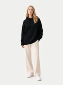 Women's Cashmere Pullover Hoodie Black worn by model, front view on white background