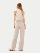 Women's Organic Cashmere Turtleneck Top Off White worn by model back view on white backround