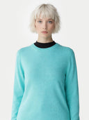 Women's Holiday Blue Cashmere Crewneck Sweater worn by model, detail view on white background 