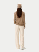 Cashmere € 99 Hat & Sweater Set Taupe worn by model, back view on white background