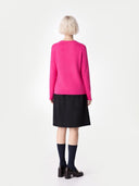 Women's Magenta Pink Cashmere Crewneck Sweater worn by model, back view on white background 