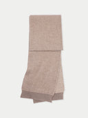 Folded beige scarf on a white background.