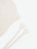Ultimate Warmth Knit Tie Hat White detail view on white background
