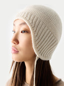 Ultimate Warmth Knit Tie Hat White detail view on white background
