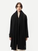 Lightweight Cashmere Shawl Black worn by model, front view on white background