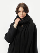 Lightweight Cashmere Shawl Black worn by model, detail view on white background
