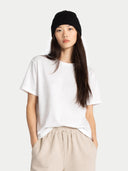 Unisex Beanie Black worn by model detail view on white background