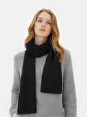 Fisherman Knit Scarf Black worn by model, detail view on white background