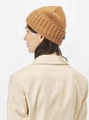 Unisex Cashmere Basic Beanie Almond worn by model, back view on white background #color_golden-brown
