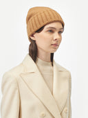 Unisex Cashmere Basic Beanie Almond worn by model, side view on white background #color_golden-brown