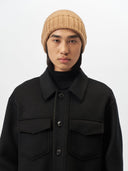 Unisex Cashmere Basic Beanie Almond worn by model, detail view on white background #color_golden-brown